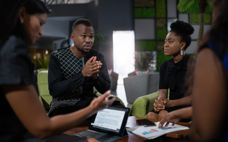business-person-having-discussion-while-sitting-office_1048944-24833276