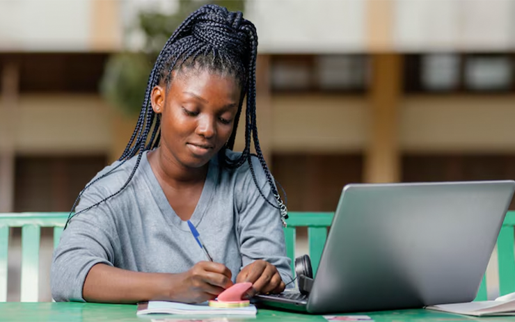 medium-shot-student-studying-with-laptop_23-2148913216
